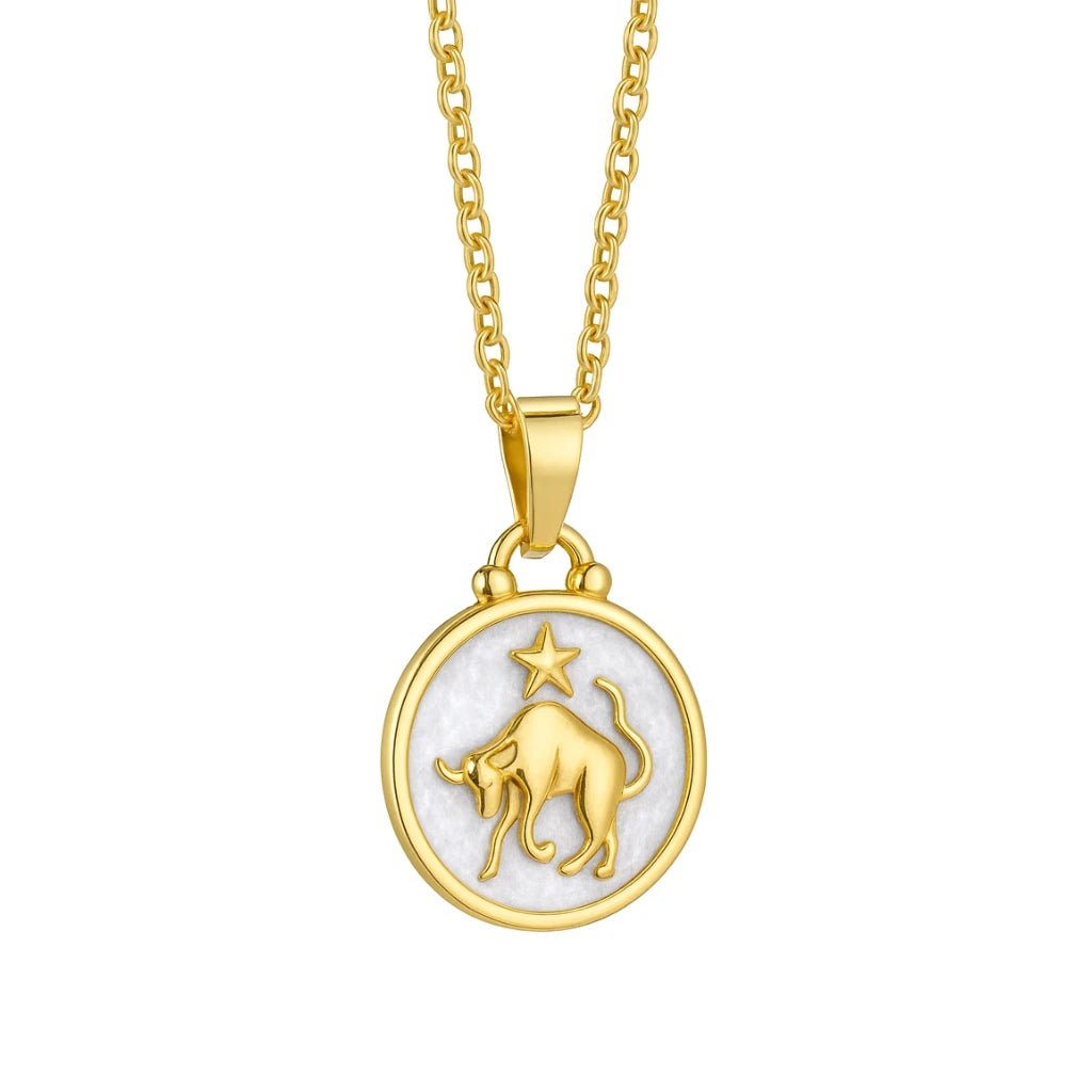 Gold necklace with a zodiac pendant featuring a bull on a white background