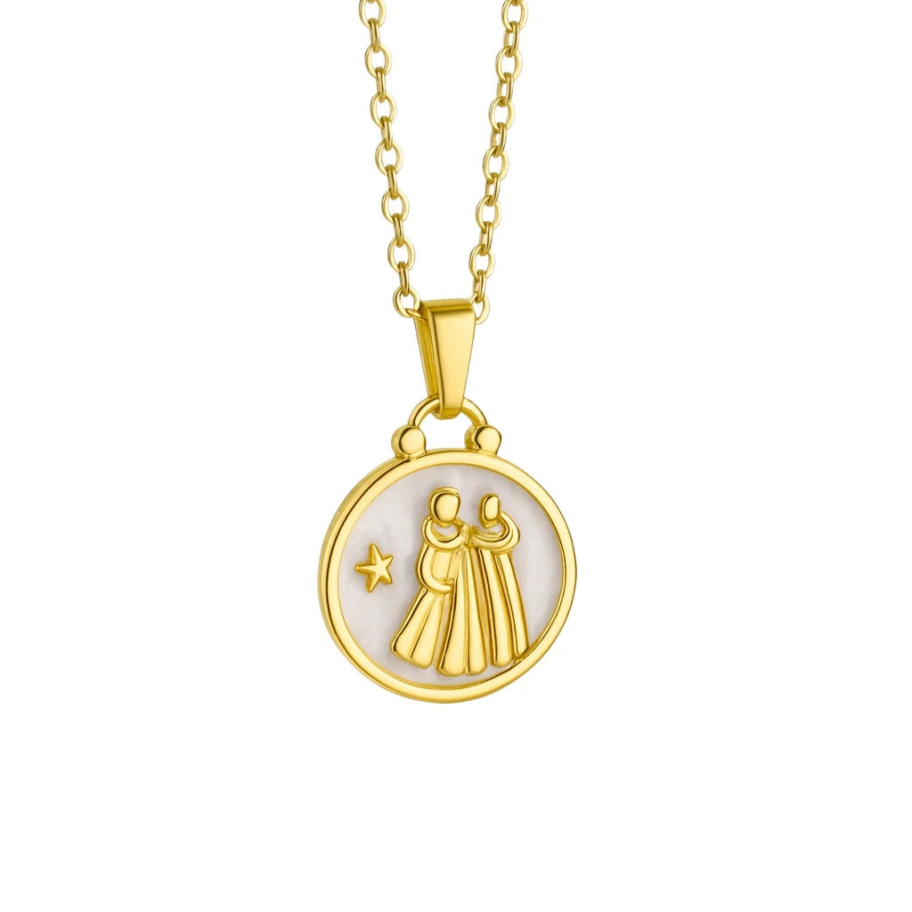 Gold necklace with a circular pendant featuring two figures and a star on a white background