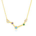 Gold necklace with a zodiac sign pendant featuring colorful gemstones on a white background