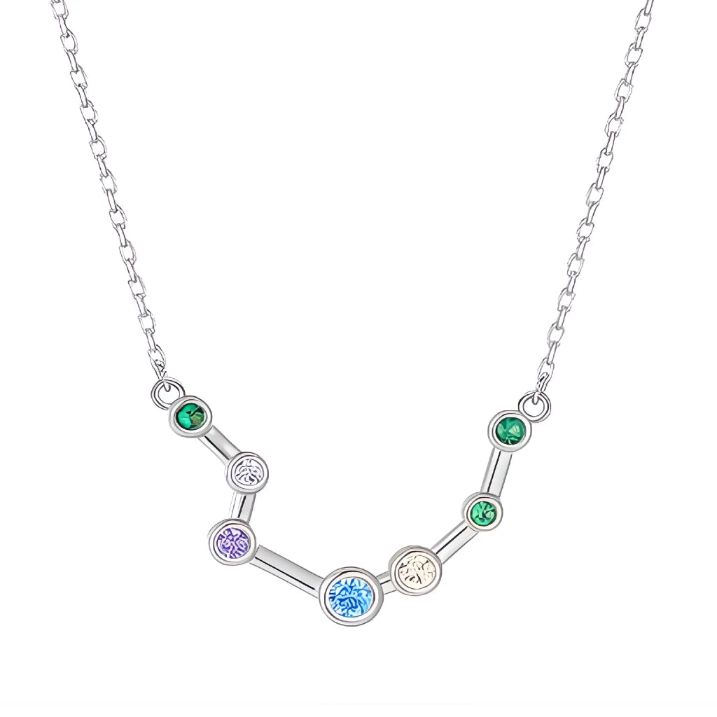 Silver necklace with a zodiac sign pendant featuring colorful gemstones on a white background
