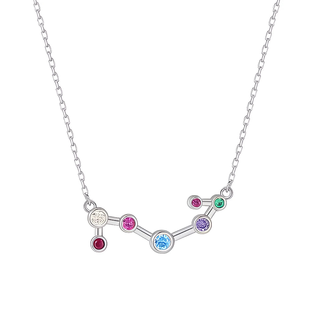 Silver necklace with a zodiac sign pendant featuring colorful gemstones on a white background