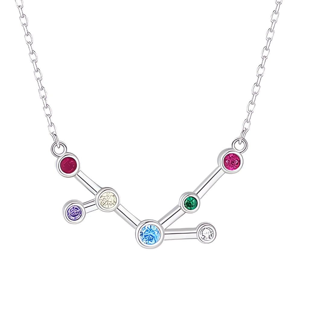 Silver necklace with a zodiac sign pendant featuring colorful gemstones on a white background