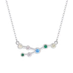 Silver necklace with a zodiac sign pendant featuring colorful gemstones on a white background