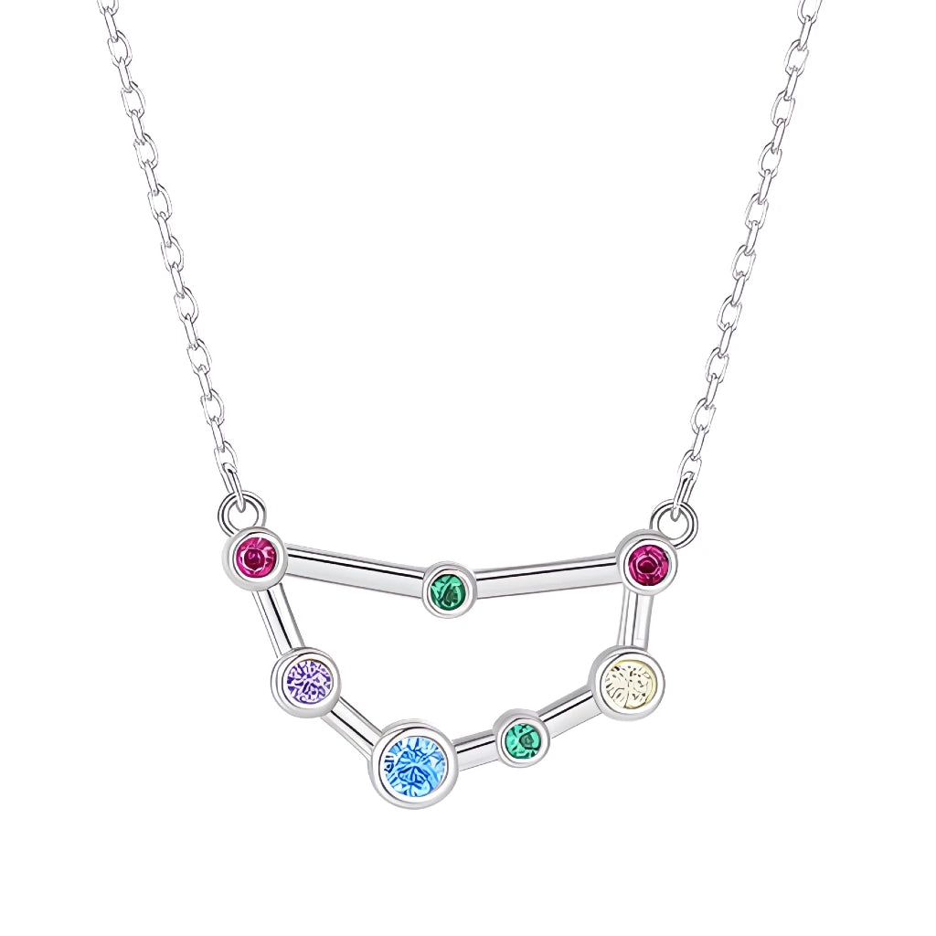 Silver necklace with a zodiac sign pendant featuring colorful gemstones on a white background