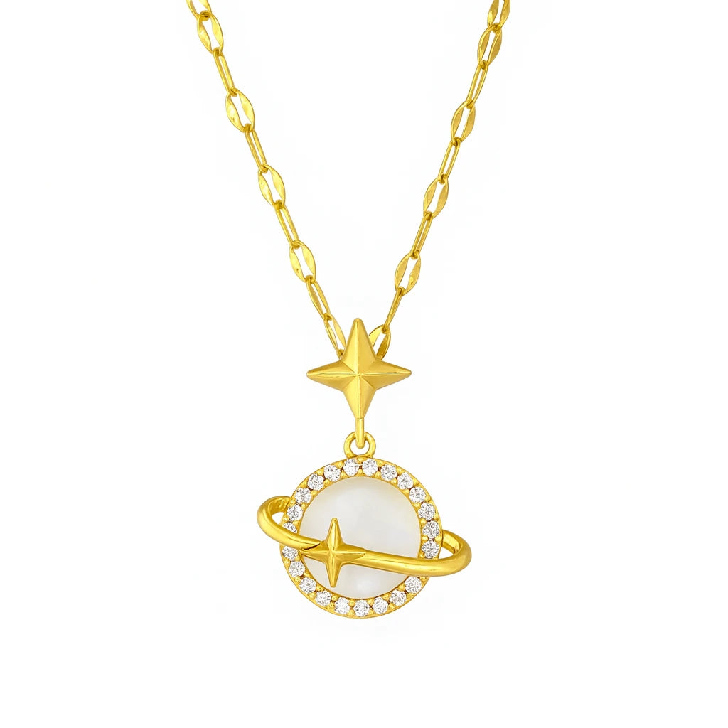 Gold necklace with star and planet pendant on a white background
