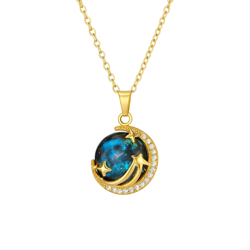 Gold necklace with a blue gemstone pendant on a white background