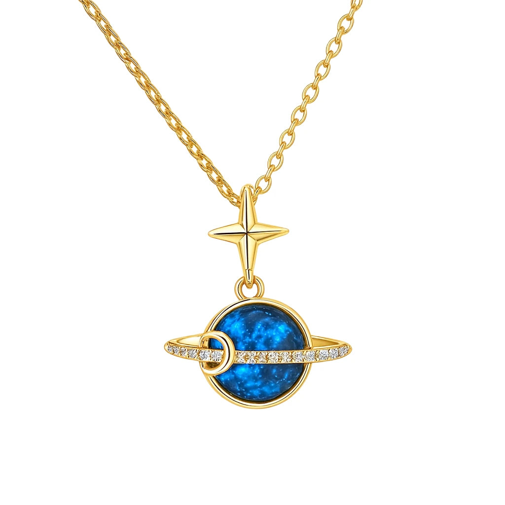 Gold necklace with a blue gemstone pendant and star accent on a white background