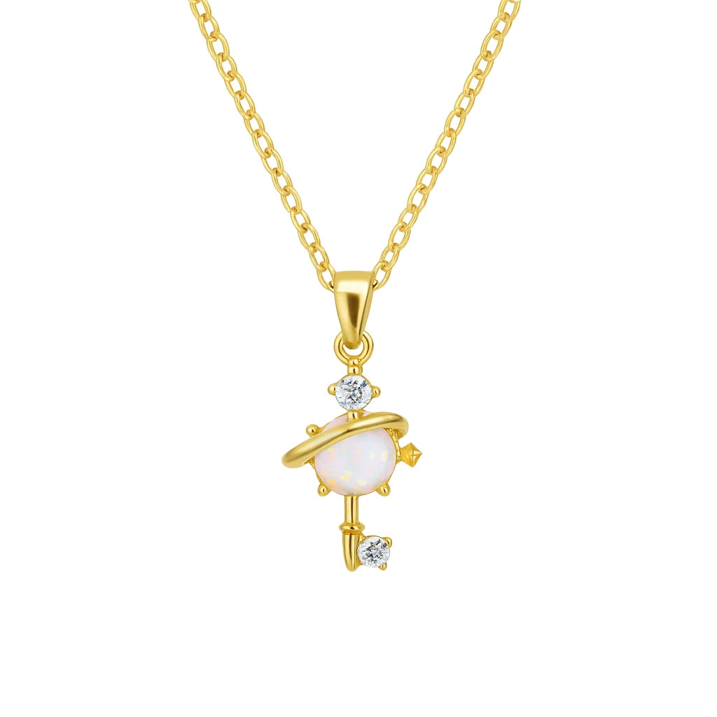Gold necklace with a heart-shaped key pendant on a white background