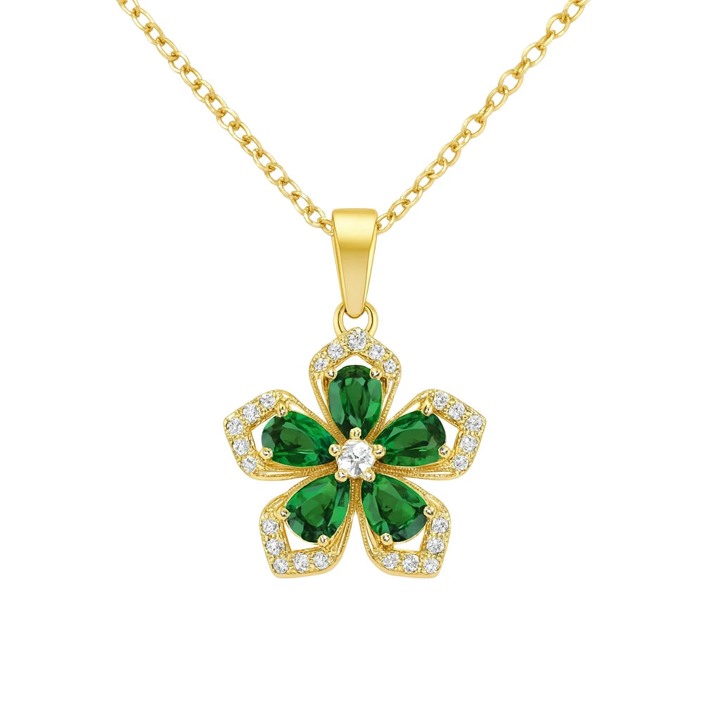 Gold necklace with a green five-leaf clover pendant on a white background