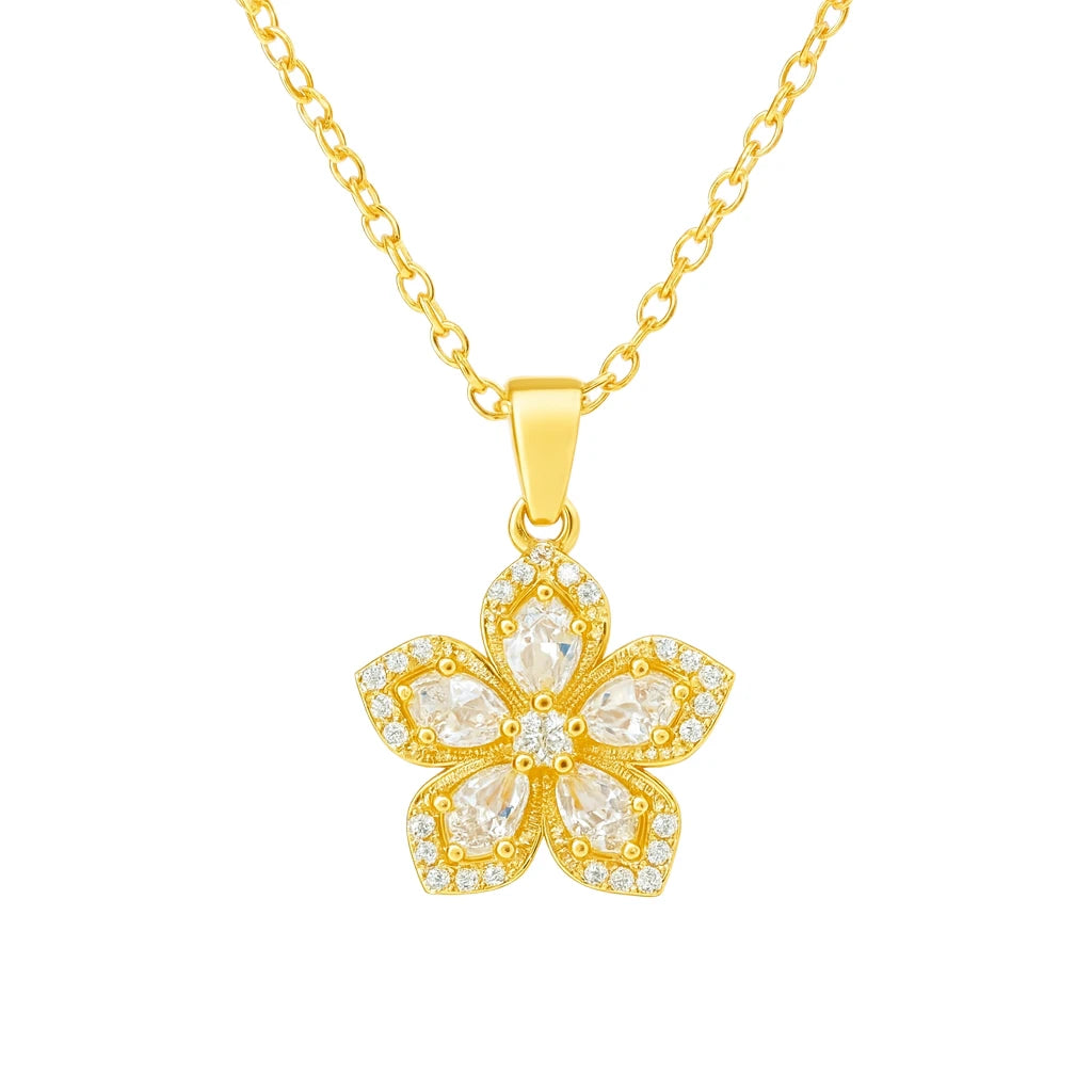 Gold necklace with a floral pendant on a white background