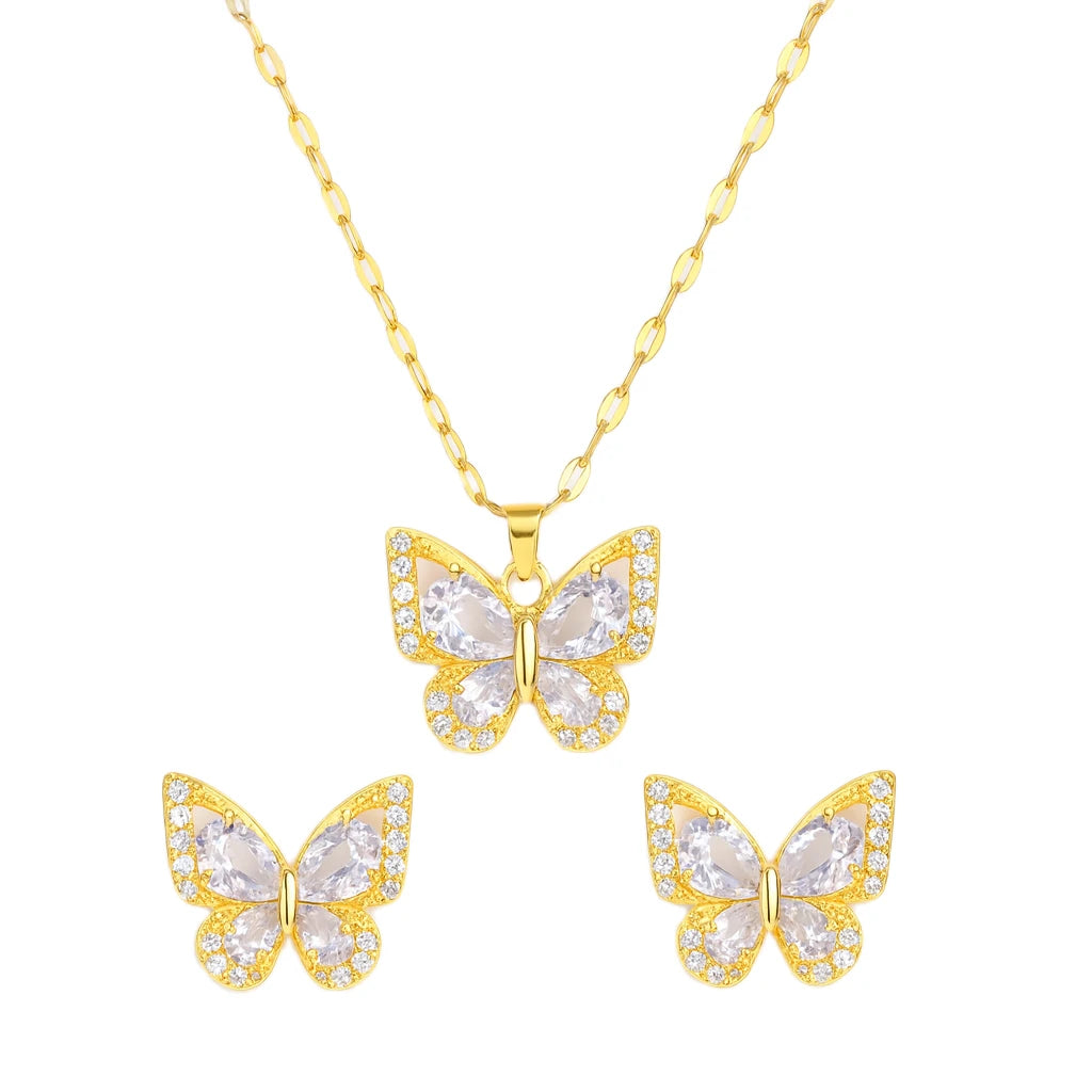 Gold butterfly necklace and earrings set on a white background