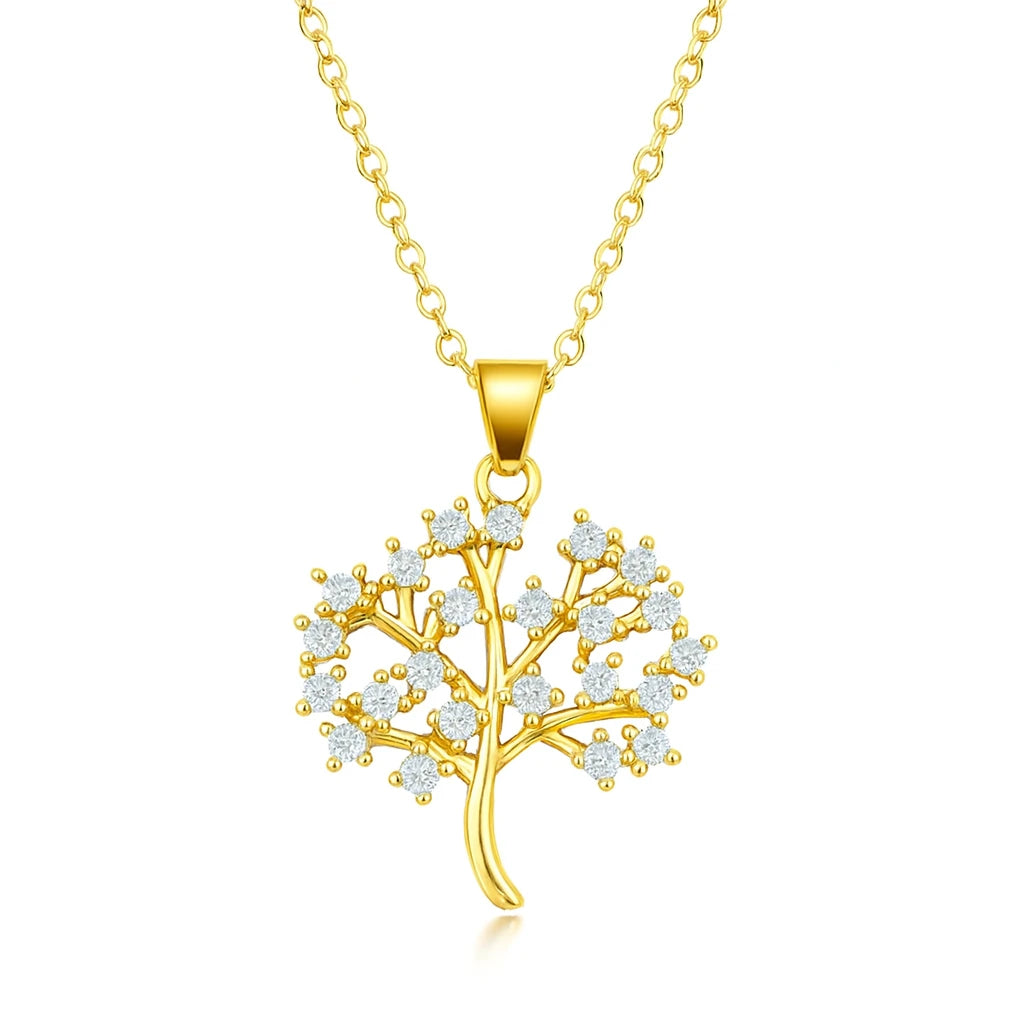 Gold tree-shaped pendant necklace with clear stones on a white background