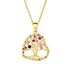 Gold tree of life pendant with colorful gemstones on a white background