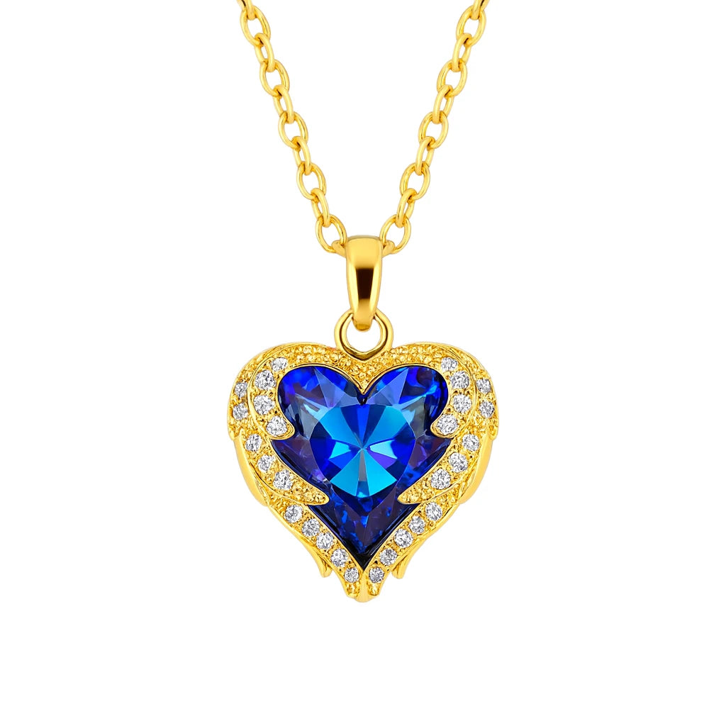 Gold necklace with a blue heart-shaped pendant on a white background