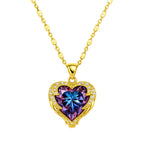 Gold necklace with a heart-shaped pendant featuring a purple blue gemstone on a white background