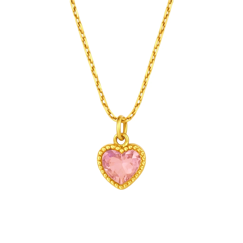 Gold necklace with a pink heart-shaped pendant on a white background
