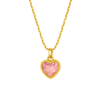 Gold necklace with a pink heart-shaped pendant on a white background