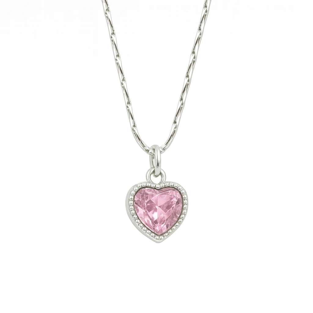 Silver necklace with a pink heart-shaped pendant on a white background