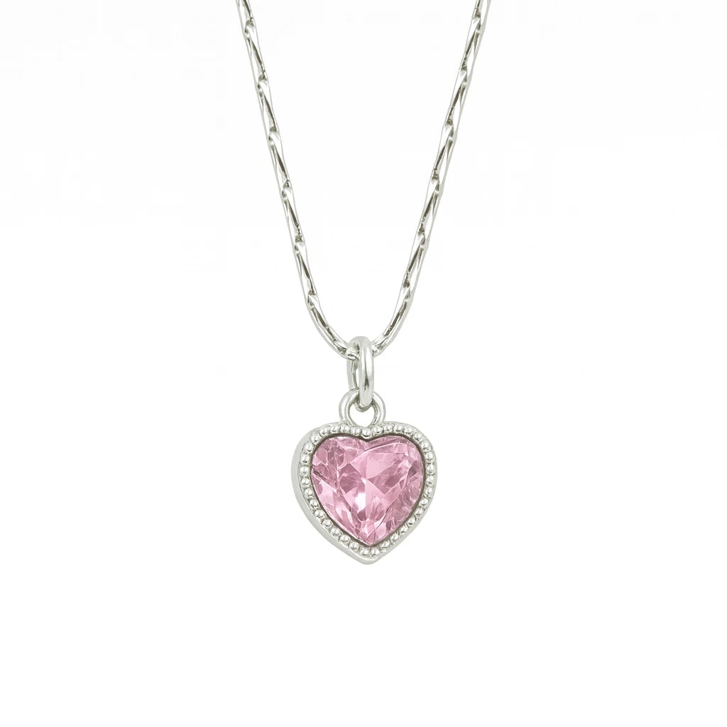Silver necklace with a pink heart-shaped pendant on a white background