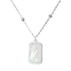Silver necklace with a rectangular pendant on a white background