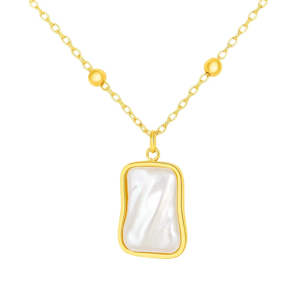 Gold necklace with a rectangular pearl pendant on a white background