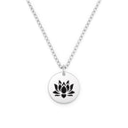 Silver necklace with a black lotus flower pendant on a white background