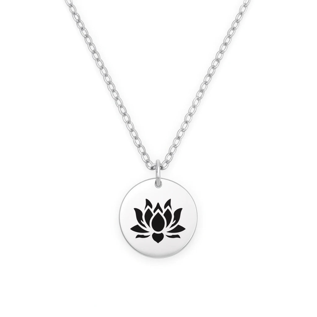 Silver necklace with a black lotus flower pendant on a white background