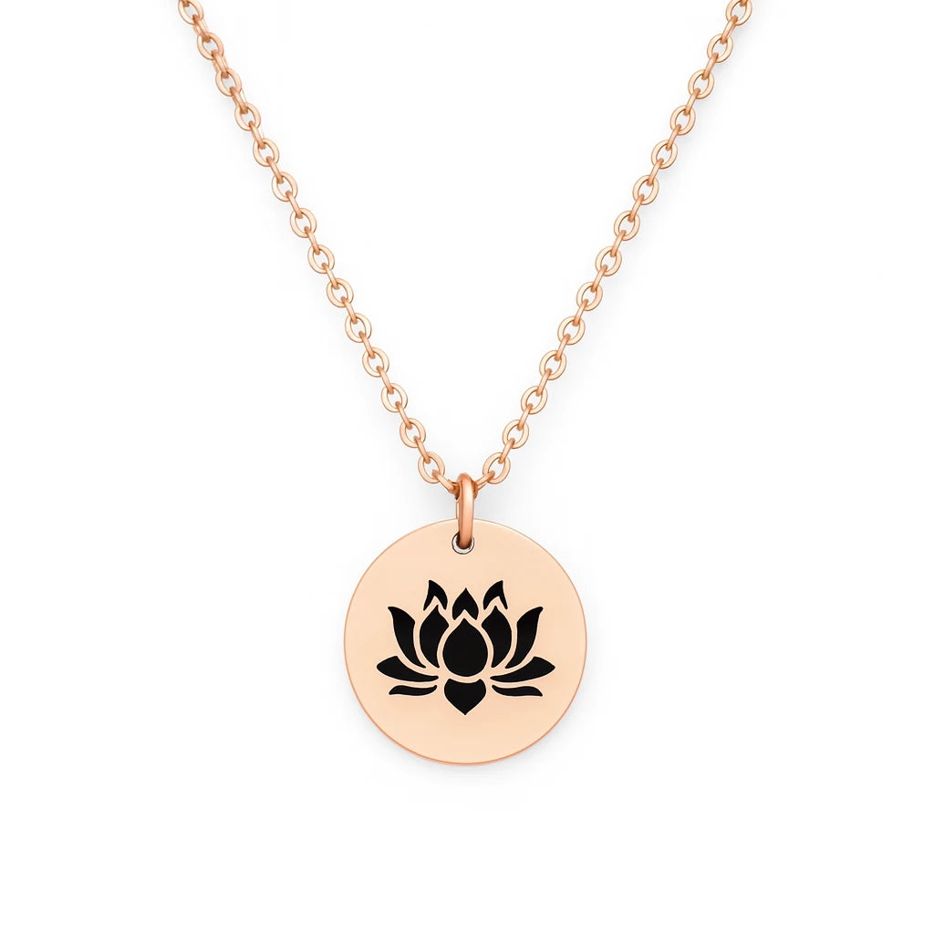 Rose gold necklace with a black lotus flower pendant on a white background