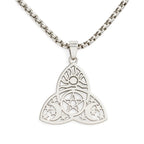 Silver pendant with intricate design on a white background