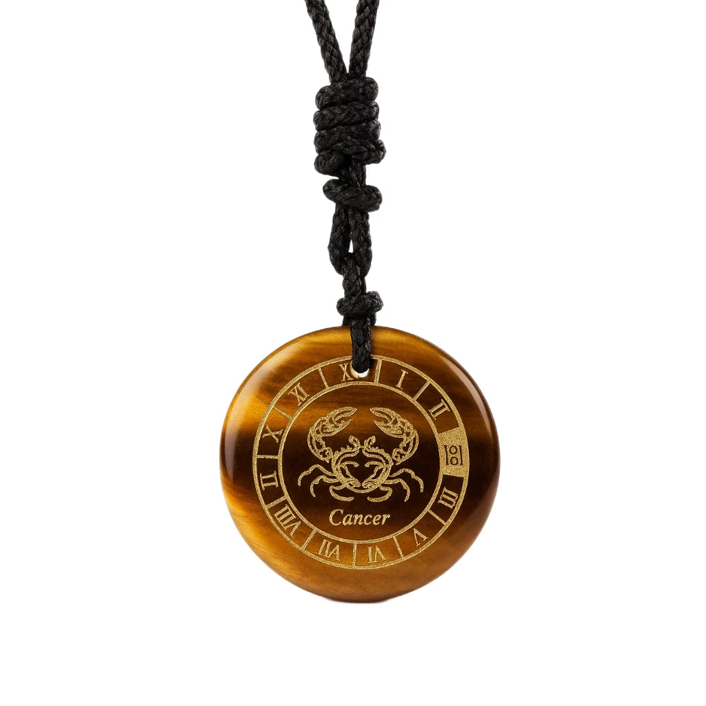 Brown pendant with Cancer zodiac symbol on a black cord against a white background
