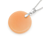 Necklace with a round orange pendant on a white background