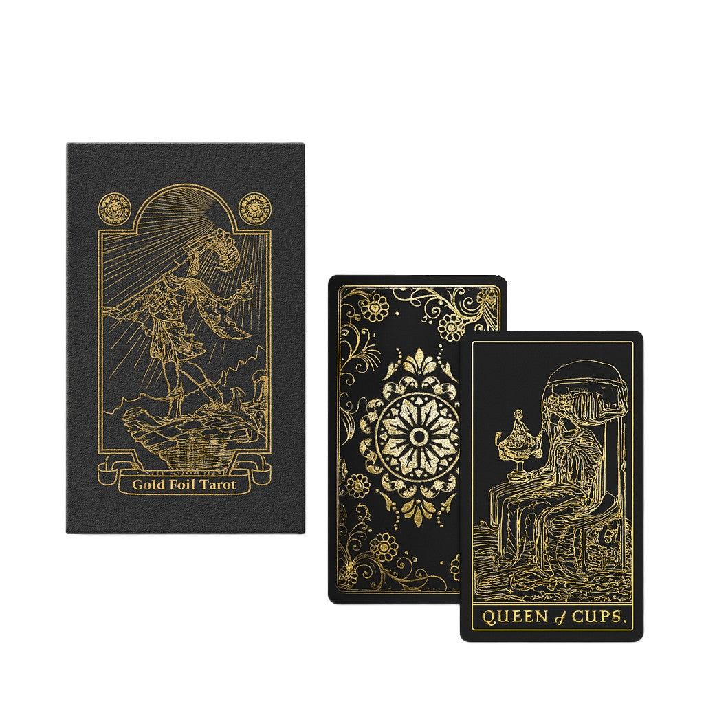 Black tarot card with gold foil design on a white background